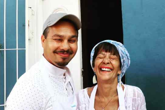 Zainie Misbach and her son, Zain, being their lovely selves as they open their door and kitchen to a Bo-Kaap cooking tour full of flavours and Cape Malay insights rooted in a fascinating history.